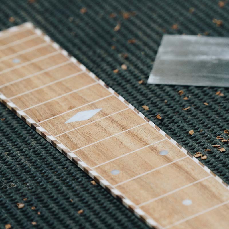 Weissenborn fretboard being scraped to final dimensions.