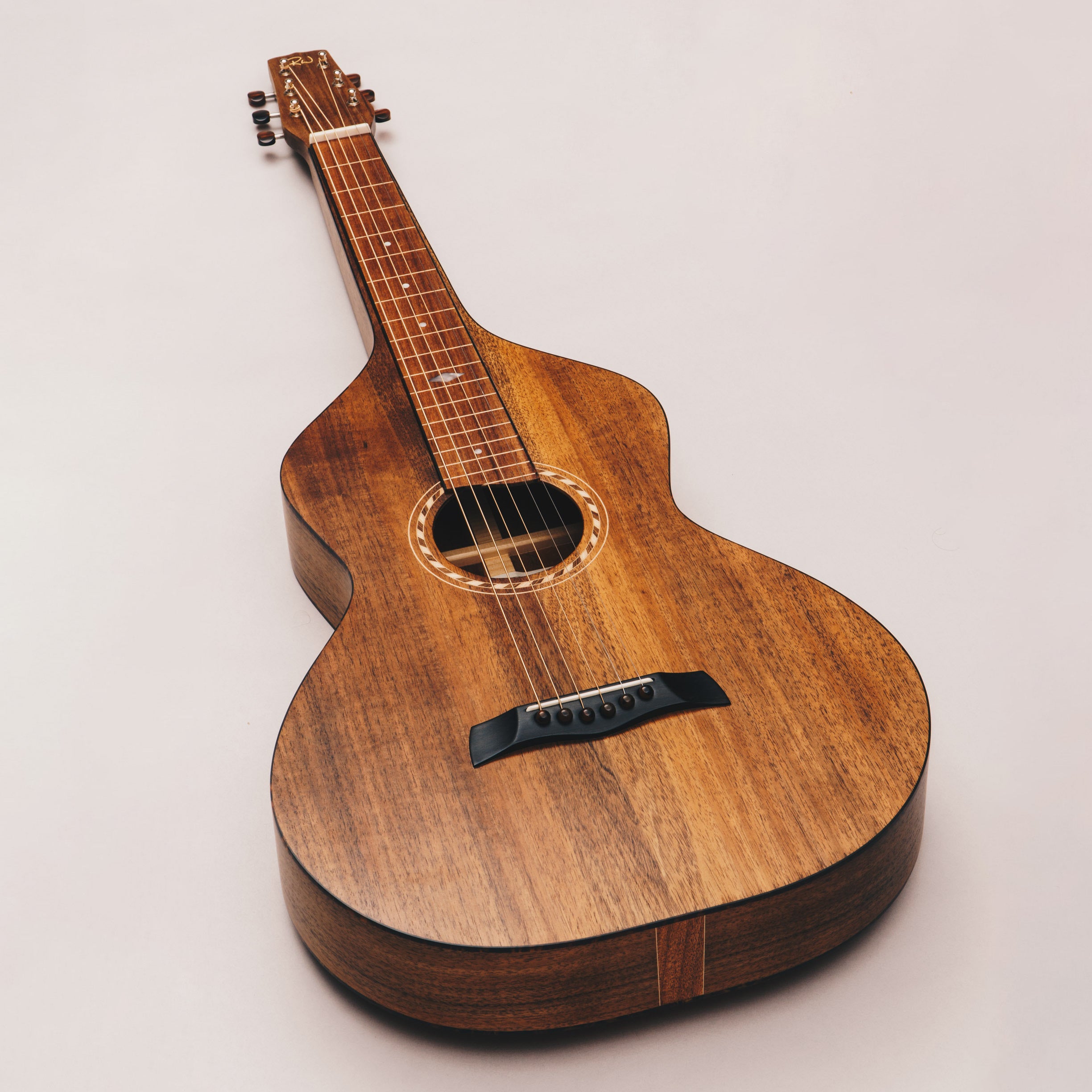 Style 2 Weissenborn guitar featuring tortoiseshell binding, tuning machines and bridge pins by Richard Wilson.